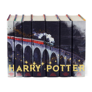 This design invites you along the journey with all of the young witches and wizards going off to another year of school. For this set, our designers reimagined the iconic image of the scarlet steam engine speeding through the Scottish countryside with gold metallic detailing (a Juniper Books first!) across the spines.