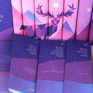 Close up of quotes printed in inner front book flap. Quotes in white san serif font against starry background. Book flaps set against spines with illustrated stag across the spines.