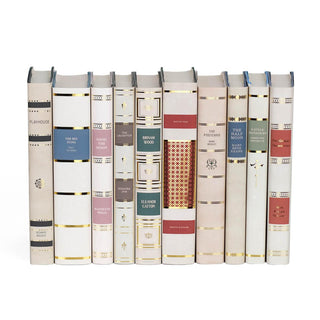 Collection of contemporary fiction books featuring custom collectible gold foil dust jackets with rich color accents from Juniper Books.