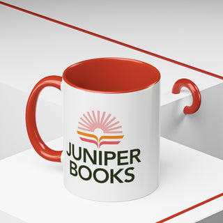 Juniper Books Logo Mug in red. Outside of mug is white with Black Juniper Books logo. Interior and handle are red.