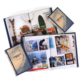 Open book view of books in Surfing The Perfect Line Book Set from Juniper Books, surrounded by other books in the series. Open book displays print size and photographs. The covers feature a large wave cresting and navy titles and the author’s name in block letters.