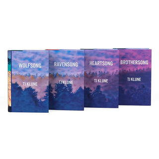 A set of four hardcover books arranged in a row, showing the front covers. Each cover features a landscape design with a forest silhouette at the bottom and a sky transitioning from blue to purple hues. The book titles are displayed in white text along with the author's name, TJ Klune. The cohesive design connects the books with similar color tones and a serene, atmospheric theme.