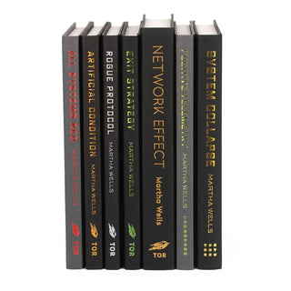 The unjacketed The Murderbot Diaries by Martha Wells showing the original spines beneath Juniper Books' book covers.