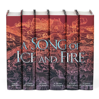 Shot of book covers on set of books feature an epic medieval battle scene in the style of an engraving which fades dramatically from red to black in a gradient overlay. 