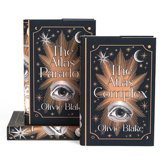 Front covers of jackets feature woodcut eye illustration between book title and author name surrounded by copper colored stars and ornamental detailing.