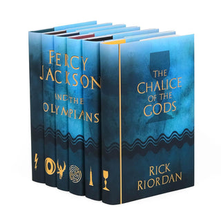 Blue watercolor style book covers featuring gold symbols on each spine and Percy Jackson and the Olympians typed across spine in gold serif font. Cover of each book feature book title and author name set against a large silhoutte of each symbol against a blue background.