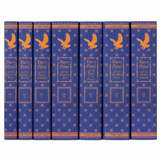 Ravenclaw book set with custom collectible blue and orange ornamental dust jackets from Juniper Books.