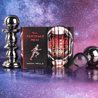 Art Prints to wrap around your books on The Murderbot Diaries by Martha Wells, styled for an eye catching shelf moment by Juniper Books.