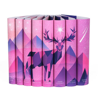 Dust jackets for Throne of Glass Series feature a illustrated stag in shades of pink and purple set against a pink and purple background. Mountains sit behind the stag mixed with a white starry background.