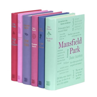 Side angle shot of faux leather books from Word Cloud. Books come in pastel pink, purple, and green. Book Covers feature word cloud of popular quotes from the books.