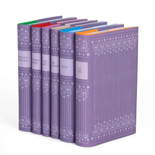 Custom collectible purple dust jackets with ornamental spines designs and book title.