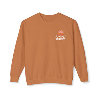 Juniper Books Crewneck Sweatshirt in Yam. Juniper Books logo and company name on left chest.