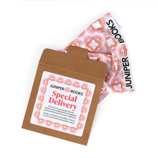 Brown envelope with 'Juniper Books Special Delivery' label and a patterned cleaning cloth with 'Juniper Books' branding on a white background.