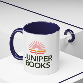 Juniper Books Logo Mug in Navy. Outside of mug is white with Black Juniper Books logo. Interior and handle are Navy.