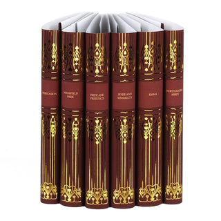 Set of six Jane Austen novels with deep red spines, ornate gold embellishments, and titles embossed in elegant faux gold font. The books include 'Persuasion,' 'Mansfield Park,' 'Pride and Prejudice,' 'Sense and Sensibility,' 'Emma,' and 'Northanger Abbey,' arranged upright on a white background.