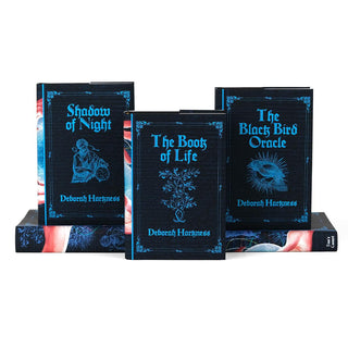 Tier arrangement of front covers of All Souls Series. Front covers feature book title, author name, and symbol related to book surrounded by ornamental frame.