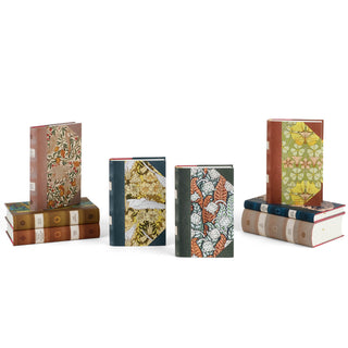 Our design emulates leather-bound books with unique art deco covers. On the spines you will find a laurel crown, a symbol of the Nobel Prize, as well as the national flower of each laureate's home country or heritage. A great gift for literature lovers! Trade. Message.