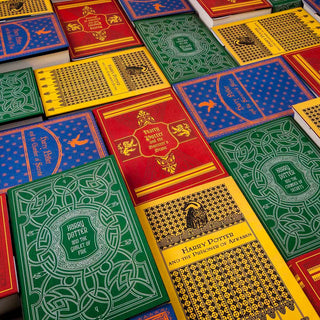 Our Harry Potter House Sets take inspiration from each of the four Hogwarts Houses: Gryffindor’s lion is set against a bright scarlet and gold combination, the eagle of Ravenclaw house accompanied by blue and bronze tones, Hufflepuff’s yellow and black adorned with a badger, and Slytherin’s iconic green and silver combination is marked with a snake - so that readers can display their house pride on their shelves.
