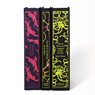 With neon accents, these three books make a big impact in person. H.G Wells. Lewis Carroll. Juniper Books custom Curation. Palette. Interior Design. Book Sets. Penguin Classics. Trade. Custom. Gift Message
