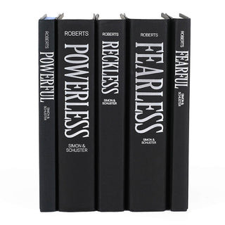 Set of five black books titled 'Powerless', 'Roberts', 'Powerless', 'Reckless', and 'Fearless' by Lauren Roberts from Simon & Schuster on a white background.