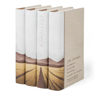 Angled view displaying spine and cover design of John Steinbeck Book Set wrapped in Juniper Books collectible book covers.