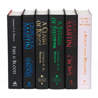 Unjacketed books in the A Song of Fire and Ice book set. Each book features book title, author, and publisher on the spine in colored foil.