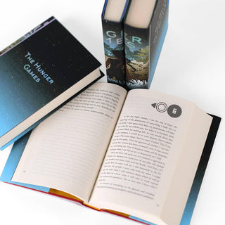 Close up image of print size in The Hunger Games books. The Hunger Games limited edition collectible book set featuring custom dust jackets from Juniper Books.