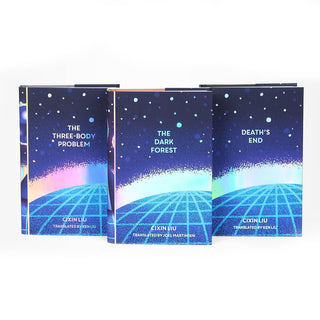 Dust jacket covers features iridescent foil texture and particles floating on blue background with a edge of a blue circle with longitude latitude lines running across it. Book title and author typed across cover in bold iridescent foil serif type. 