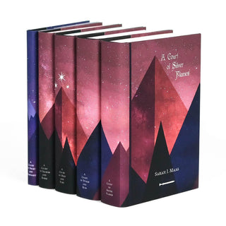 Custom collectible dust jackets feature pink and purple mountains adorned with three stars span across book spines in the A Court of Thorns and Roses Book Set.