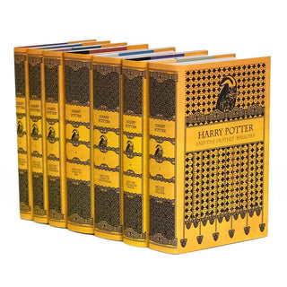 Hufflepuff book set with custom collectible yellow and black ornamental dust jackets from Juniper Books.