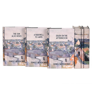 Front covers of the Ernest Hemingway set from Juniper Books. Covers feature book title and author and a portion of the painting "Rooftops" by Paul Cézanne.