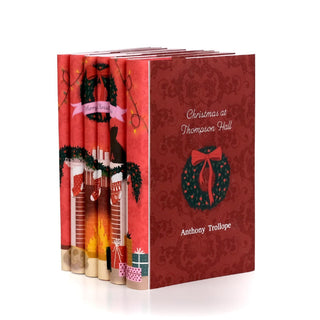 Angled view of the Christmas Classics 2026 book set by Juniper Books, each cover features a Christmas motif.