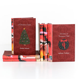 Christmas Classics 2026 book set by Juniper Books, two dust jackets showing covers featuring a wreath and a Christmas tree.