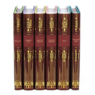 Set of six Jane Austen novels with deep red spines, ornate gold embellishments, and titles embossed in elegant faux gold font. The books include 'Persuasion,' 'Mansfield Park,' 'Pride and Prejudice,' 'Sense and Sensibility,' 'Emma,' and 'Northanger Abbey,' arranged upright on a white background.