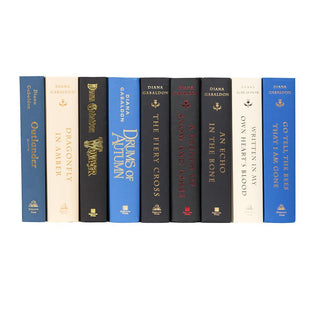 Unjacketed Outlander books by Diana Gabaldon showing original spines beneath Juniper Books book covers.