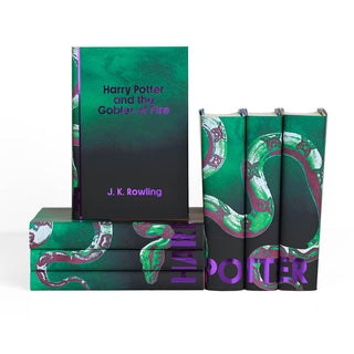 Harry Potter and the Goblet of Fire wrapped in Green Slytherin jacket sitting on stack of three other Slytherin jacketed books