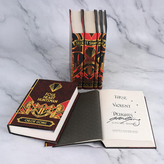 Author signature on the title page of These Violent Delights by Chloe Gong, with book jackets designed by Juniper Books.