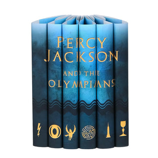 Percy Jackson and the Olympians type across dust jackets in gold serif type. Blue covers with a dark blue wave patterns and gold symbols on each spine.