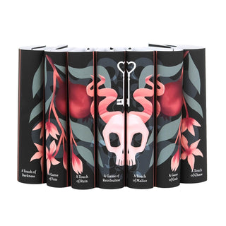 Hades x Persephone Saga dust jackets by Juniper Books, shown without books to reveal the horned skull and pomegranate art across the spines.