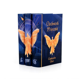 Angled view of the Juniper Books Infernal Devices hardcover book set showing runes along each spine.