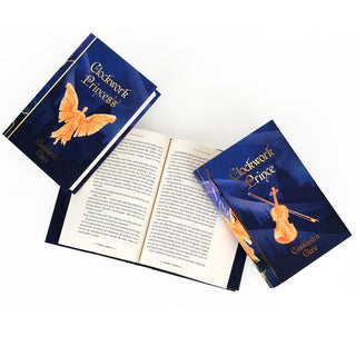 Gold foil rays and Shadowhunter runes on the spines of the Limited Edition Infernal Devices book set by Juniper Books