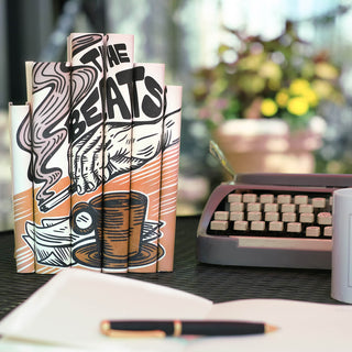 Inspired by the smokey cafes where these artists spent their time writing and performing, our limited palette design evokes this unique literary movement.